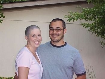 smiling woman, man with shaved heads