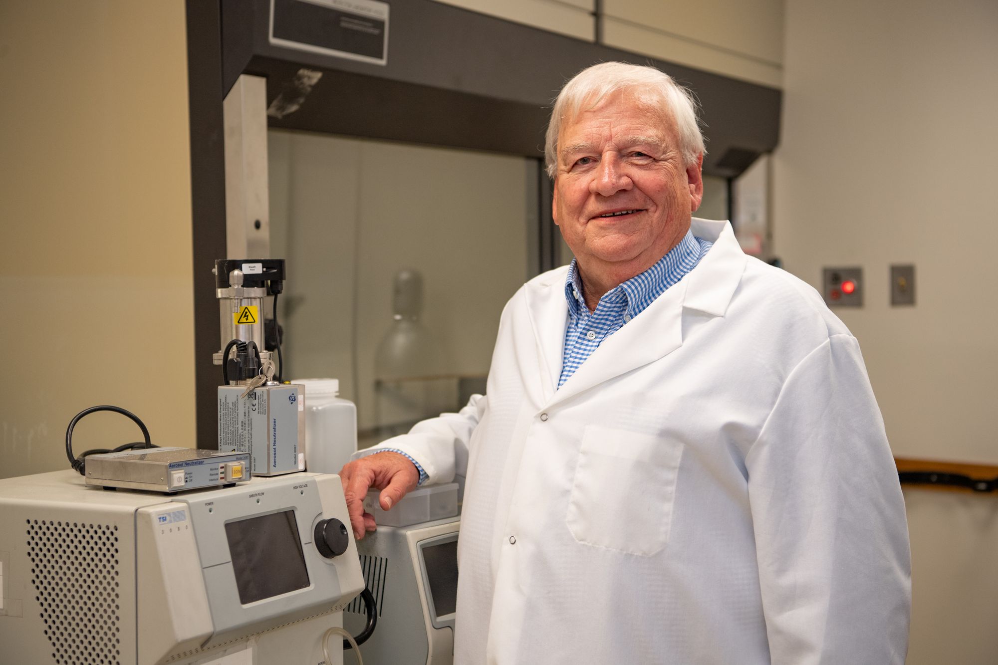 Man smiling in lab coat