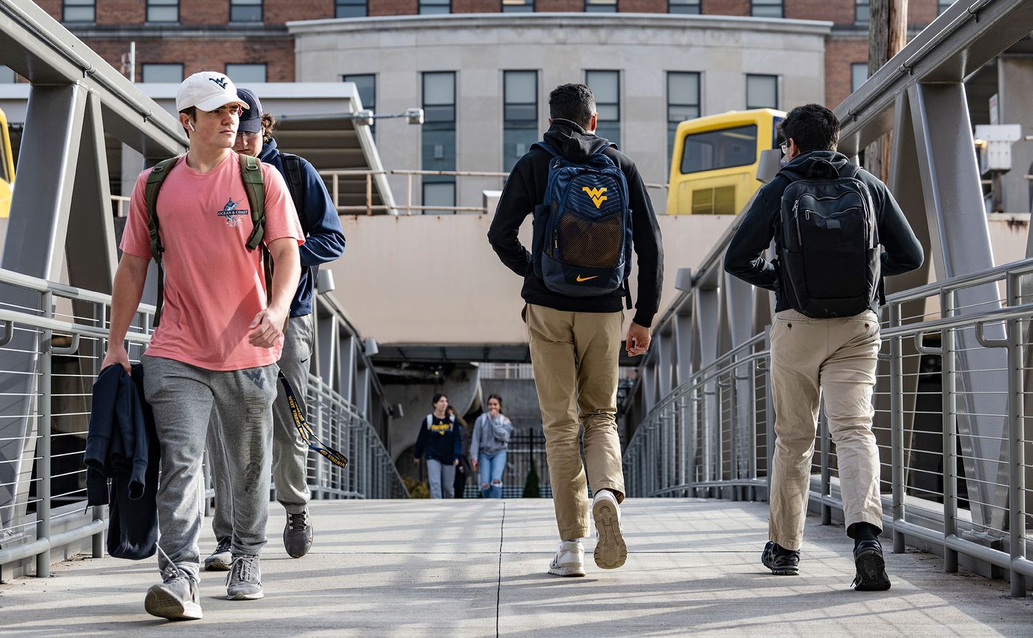 students on walkway in front of reynolds hall
