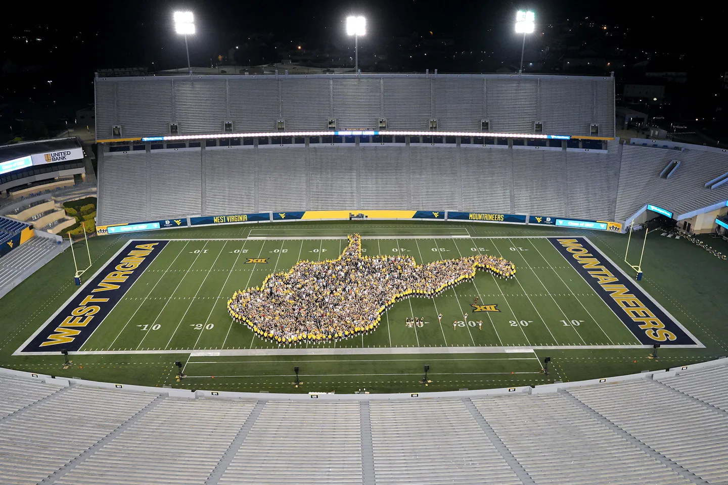 people form the state of WV on a football stadium field