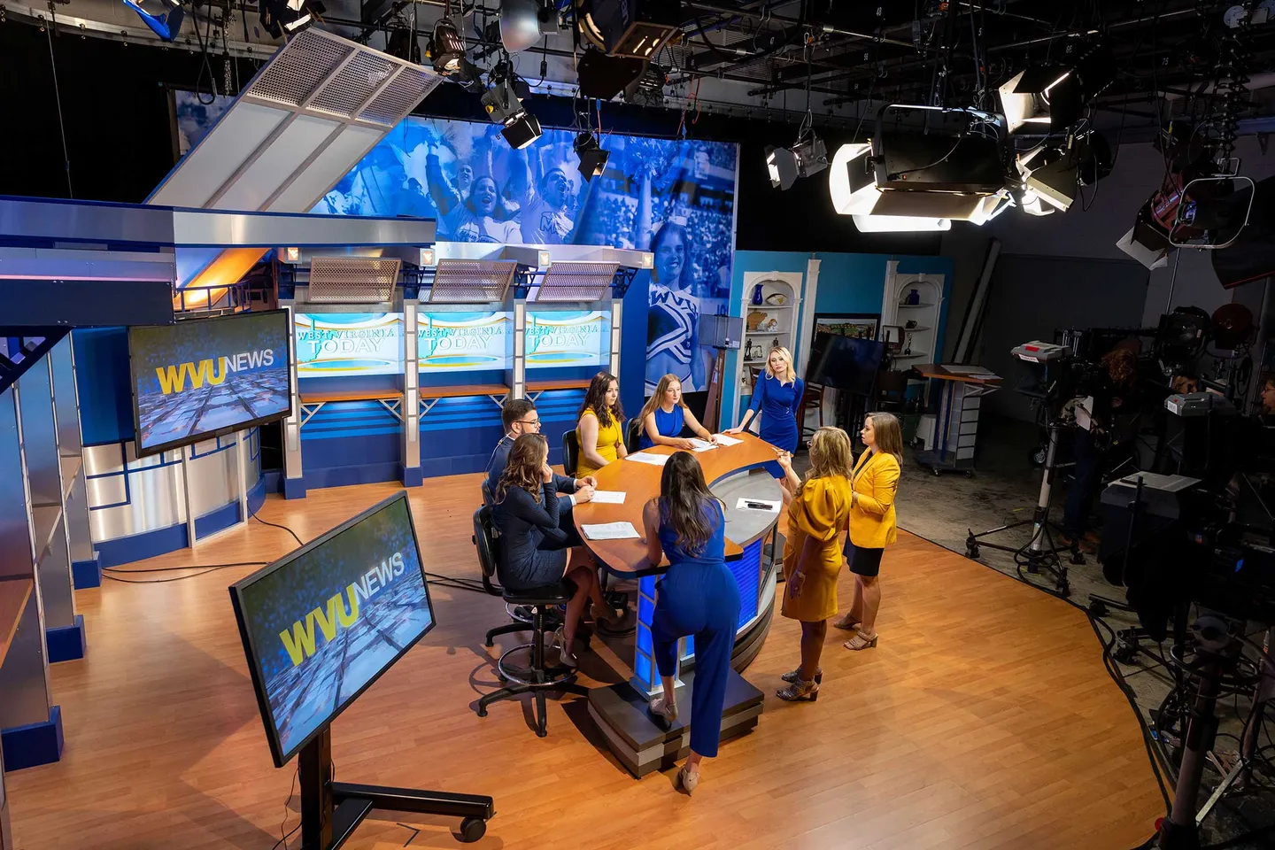 The WVU News team prepares for a broadcast in the studio.