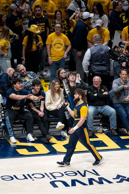 Mikel Hager works the crowd as a WVU cheerleader